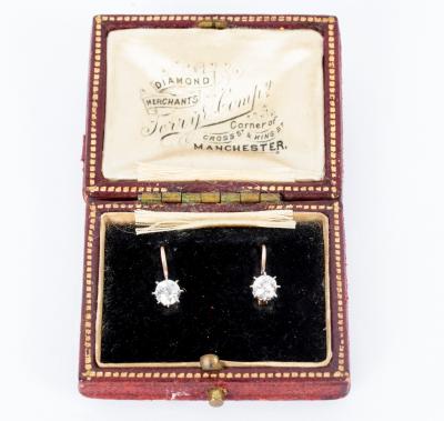 A pair of diamond earrings, each