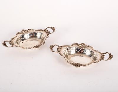 A pair of small silver two-handled