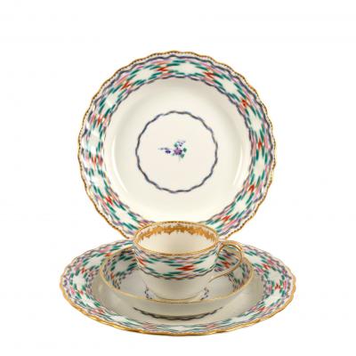 A Derby cup and saucer and two plates,