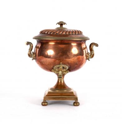 A copper samovar with ivory handles,