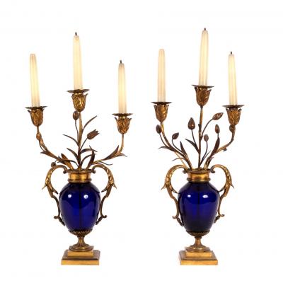 A pair of blue glass and gilt metal