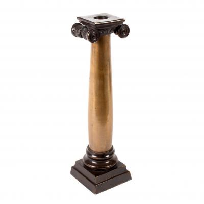 A bronze candlestick of Ionic column