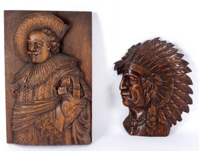 A carved wood panel of a cavalier,