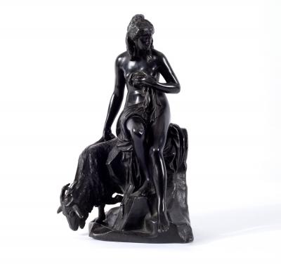 A patinated figure of a girl with a