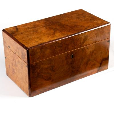 A Victorian walnut tea caddy enclosing 2ddf8a