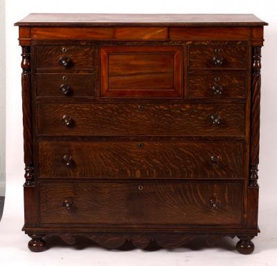 A Victorian oak chest of five short