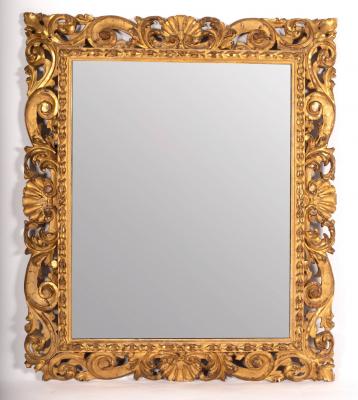 A carved and gilded frame with pierced