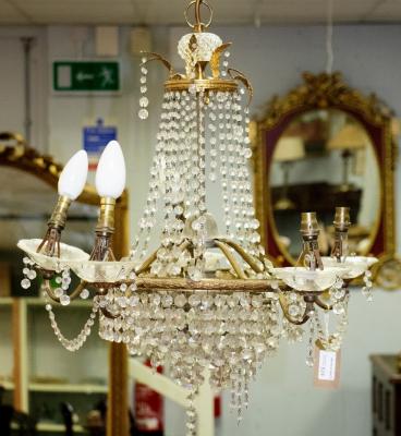 A five-branch chandelier hung with swags