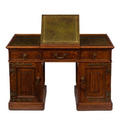 A Gothic revival oak desk with
