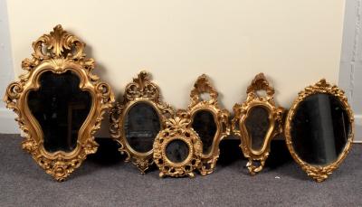 A gilt framed wall mirror of cartouche 2de006