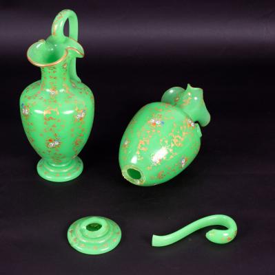 A pair of green opaline glass ewers,