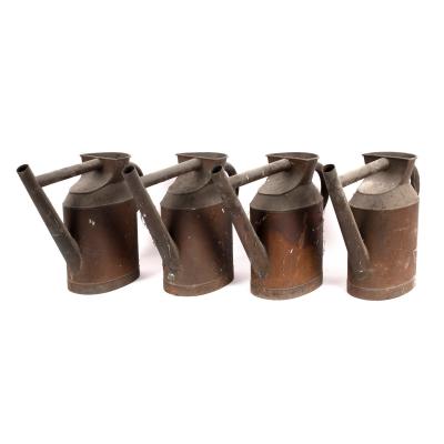 Four copper watering cans, 42cm