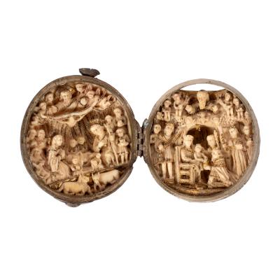 An ivory devotional rosary bead of spherical