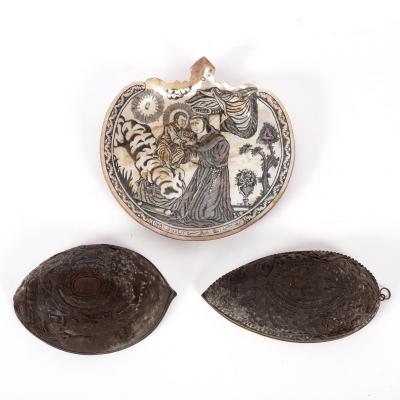 Two profusely carved coconut shell