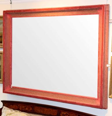 A large wall mirror, the rectangular