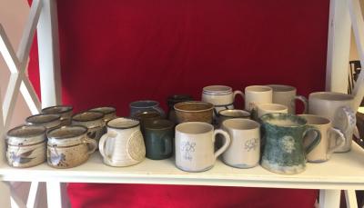 Six Vellow pottery mugs and various