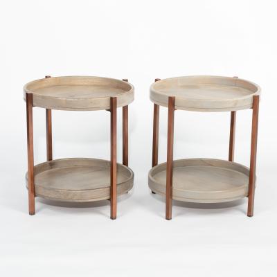 A pair of modern circular two-tier tables,