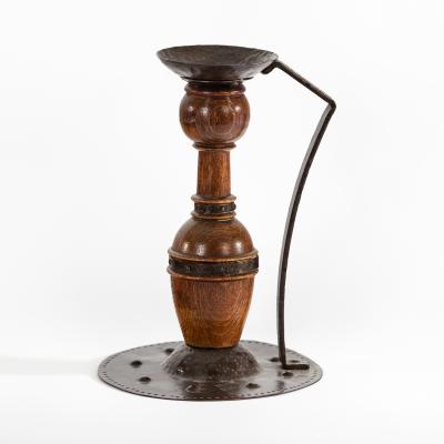 A Jugendstil copper and wood candlestick 2de516