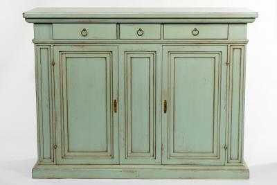 A green painted cupboard with drawers