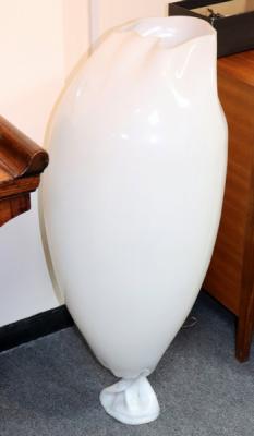 A white composition floor lamp,