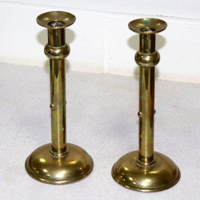 A pair of Arts & Crafts brass candlesticks,
