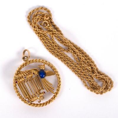 An 18ct gold and gem set pendant