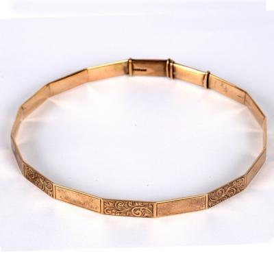 A 9ct gold arm bangle of polygonal 2de597