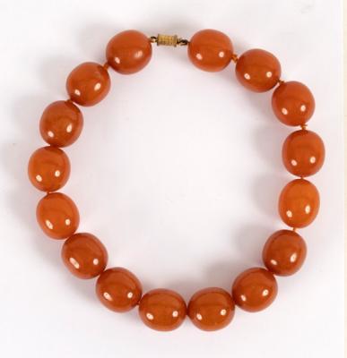 An amber necklace of large slightly