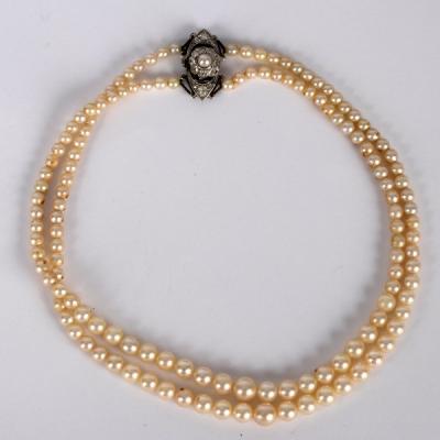 A two-row pearl necklace, the rows