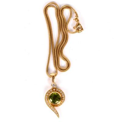 A peridot and diamond pendant by