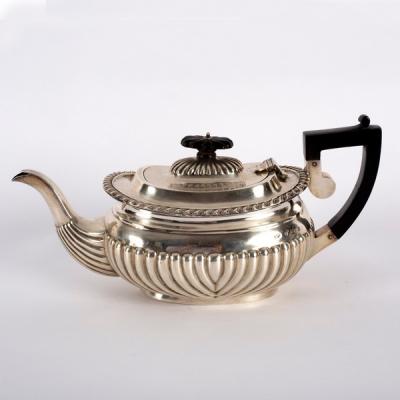 A silver teapot, J & C, Birmingham 1904,