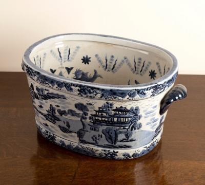 A large blue and white willow pattern