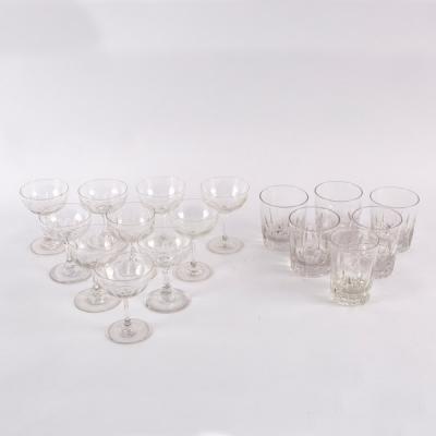 Ten wine glasses with thumb pressed