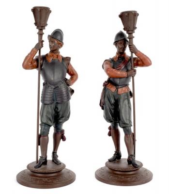 A pair of figural candlesticks, the
