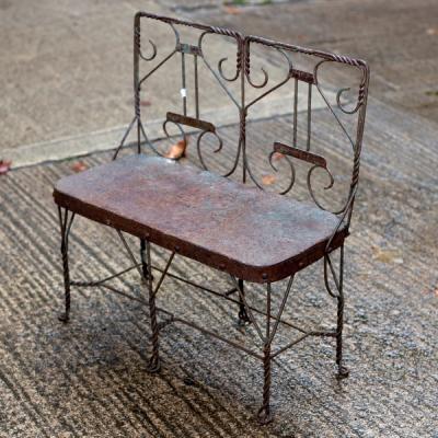 A wirework jardinière stand of bench