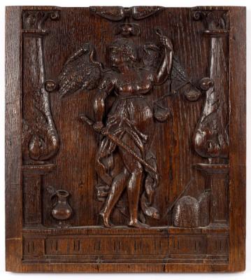 A 17th Century carved oak panel