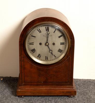 An arch-top mantel clock, the silvered