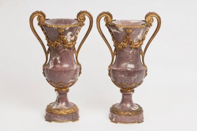 A pair of mauve veined marble vases 2dc6cf