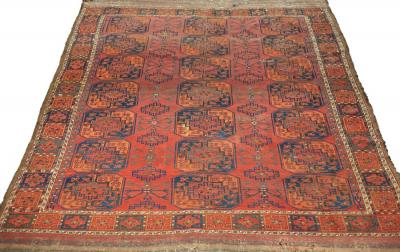 An Afghan carpet circa 1900, with