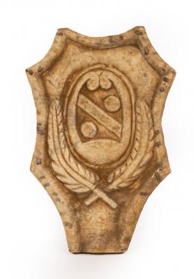 An alabaster panel of cartouche shape