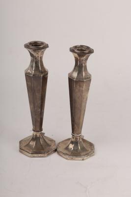 A pair of silver candlesticks,