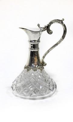 A silver mounted cut glass claret