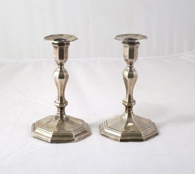 A pair of Edwardian silver candlesticks,