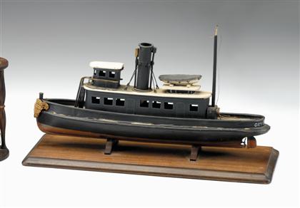 Painted wooden model of the tug