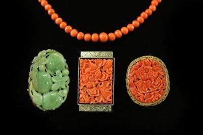 A carved jade brooch modelled as 2dc8b9
