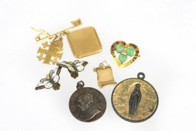 A heart-shaped brooch, set with three