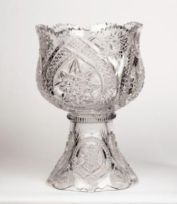 A large cut glass punch bowl with serrated