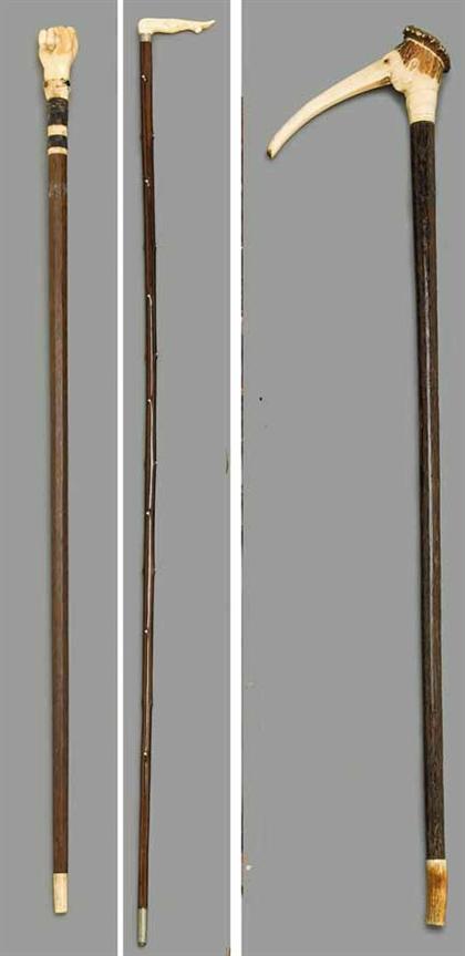 Group of three walking sticks with 49420