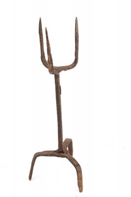 A wrought iron pricket candlestick  2dc99c