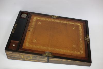 A coromandel lap desk with leather lined